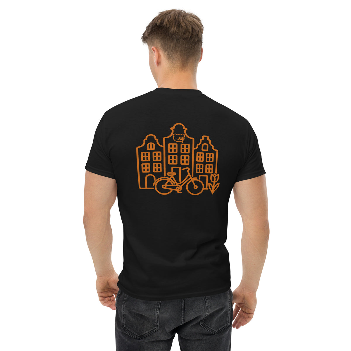 Back of a black T-shirt featuring copper line art of Amsterdam canal houses, a bicycle, a tulip and the Teddy O’Broin emblem.