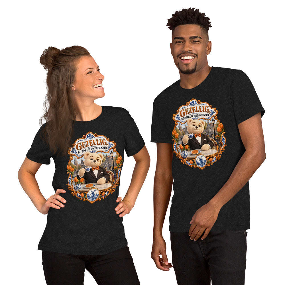 Black Heather T-shirt featuring Teddy O’Broin wearing a tuxedo and monocle beside an Amsterdam canal with tulips, a Delft cup and stroopwafel beneath the words Gezellig, But Make It Distinguished.